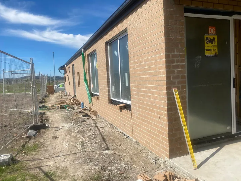 Tan brick veneer on a new single-storey home
